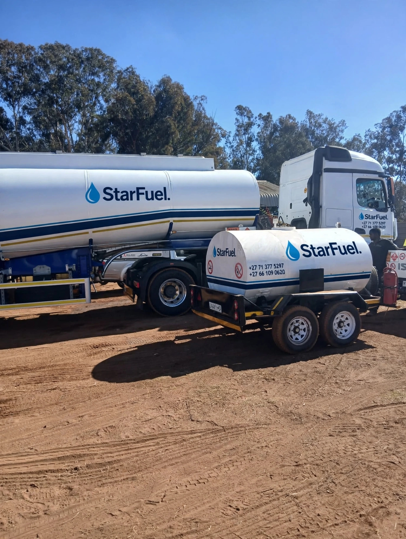 StarFuel bulk tanker and bowser trailer parked on red soil